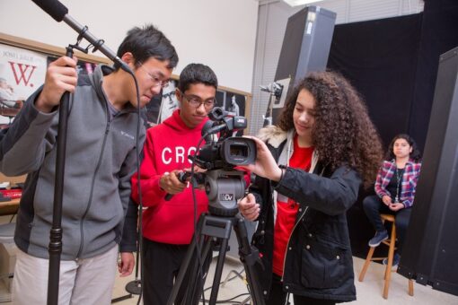Students learning how to operate a professional video camper