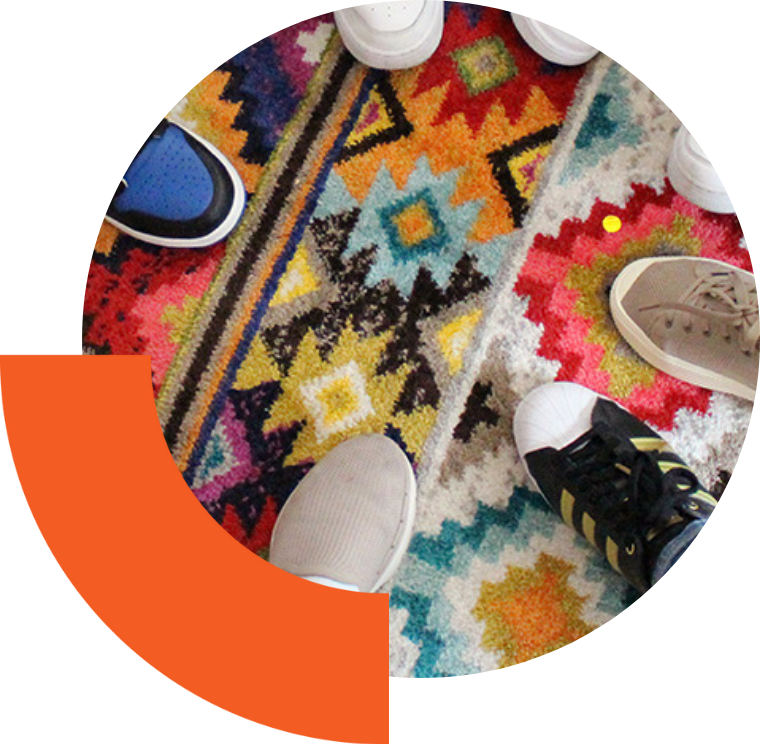 Team members putting their shoes into a circle