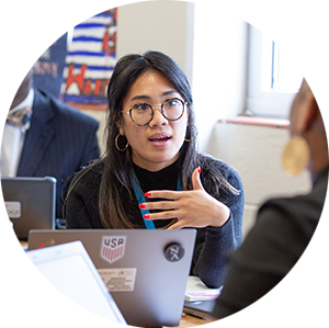 Professional engaging in conversation with others