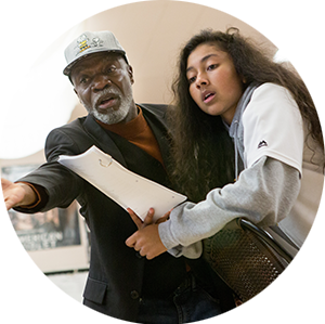 Young student engaging with her grandfather