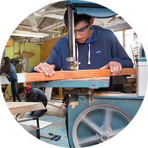 Young student learning carpentry skills